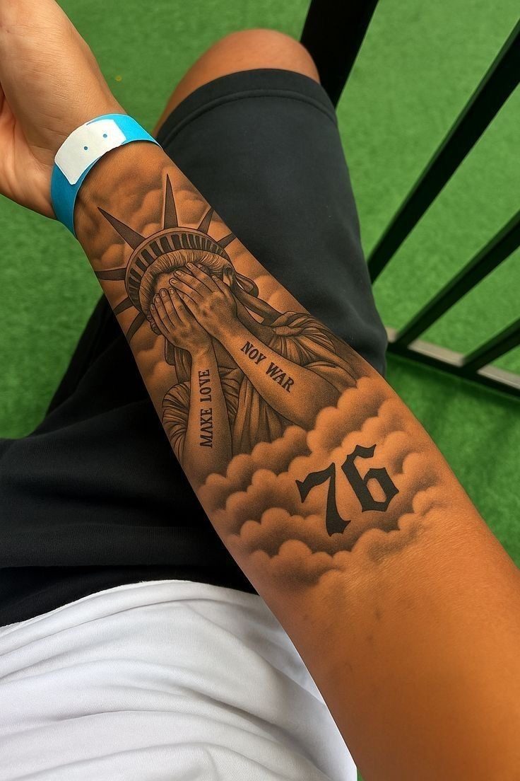 Statue of Liberty realism tattoo with clouds, forearm